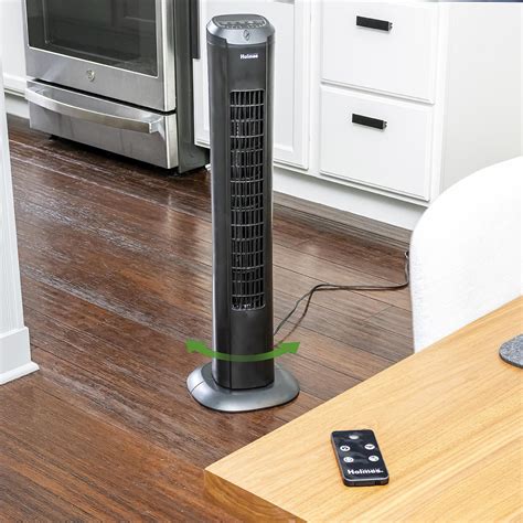 Holmes 13" Oscillating 3 Speed Mini Tower Fan with Digital Clock Black. . Holmes digital tower fan
